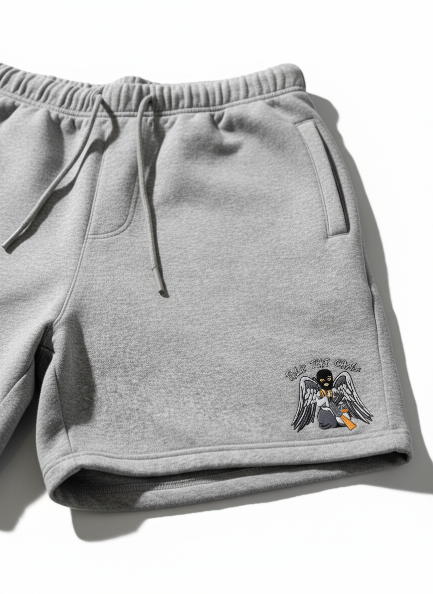 TTG Shorts with Angel emblem on white background